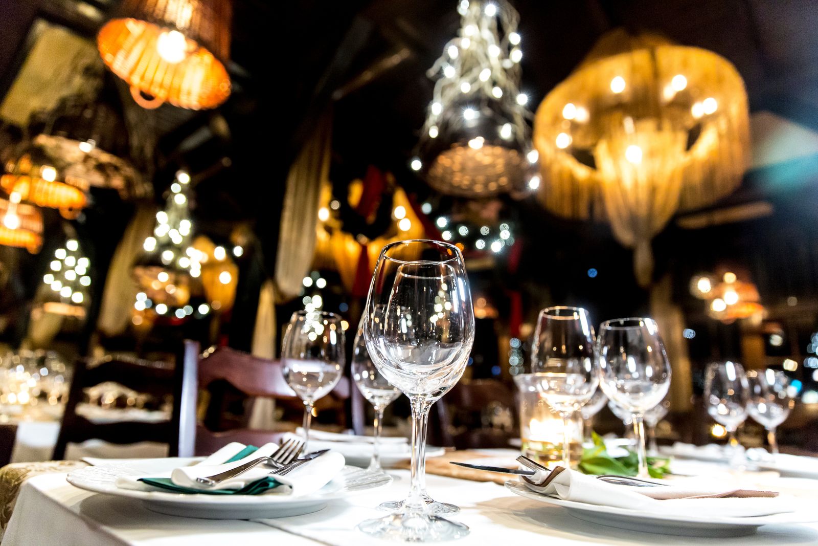 An elegantly laid long table set for a private dinner